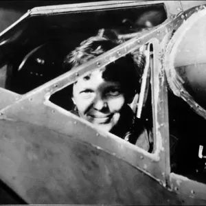 Amelia Earhart looking through the cockpit window