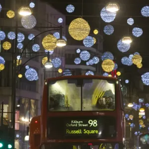 Print of London buses under Oxford Street Christmas lights Print of London buses under Oxford Street Christmas lights