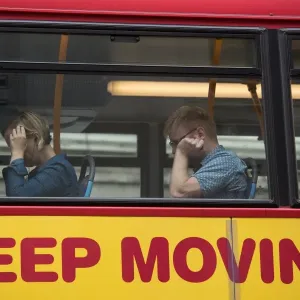 Britain Print: Commuters on a Bus with Keep Moving Ad Britain Print: Commuters on a Bus with Keep Moving Ad