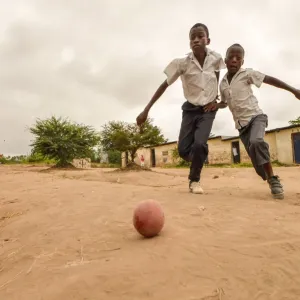 Children play football in the streets of the Kinsuka neighbourhood in the city of Children play football in the streets of the Kinsuka neighbourhood in the city of
