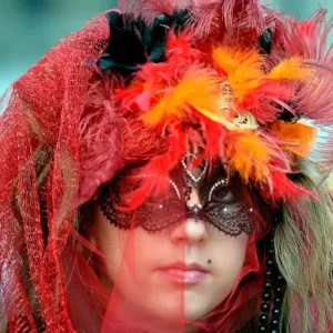 A costumed reveller poses near Saint Marks square during the carnival on February 21 A costumed reveller poses near Saint Marks square during the carnival on February 21