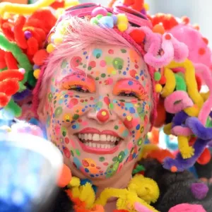 A costumed woman celebrates the street carnival in Duesseldorf, western Germany on February 27 A costumed woman celebrates the street carnival in Duesseldorf, western Germany on February 27