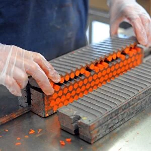 An employee makes pastels in a workshop at the Raphael-Isabey-Sennelier factory in Saint-Brieuc