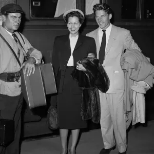 Print of Two Actors Boarding a Train to Cannes Film Festival