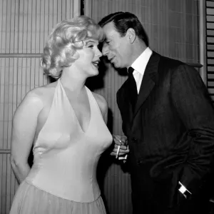 French Actor and Singer Yves Montand Whispers to Marilyn Monroe French Actor and Singer Yves Montand Whispers to Marilyn Monroe