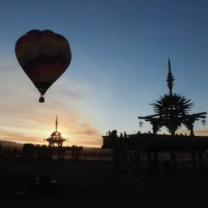 Hot air balloon flies over the Solar Temple at dawn at the Symbiosis Oregon Eclipse Festival Hot air balloon flies over the Solar Temple at dawn at the Symbiosis Oregon Eclipse Festival