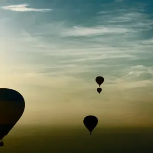 Hot-air balloons fly over buildings on the outskirts of Minsk on September 12, 2014 Hot-air balloons fly over buildings on the outskirts of Minsk on September 12, 2014