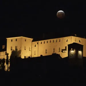 Print of a total lunar eclipse over northwestern Italy