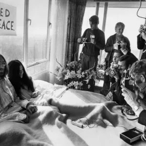 John Lennon and his wife Yoko Ono Receiving Journalists John Lennon and his wife Yoko Ono Receiving Journalists