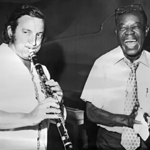 Louis Armstrong playing with French trumpeter Maxime Saury Louis Armstrong playing with French trumpeter Maxime Saury