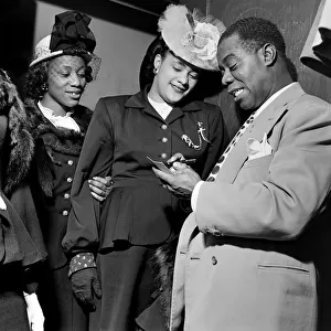 Louis Armstrong signing for fans