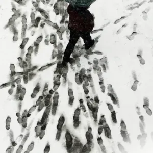 Print of a man holding an umbrella in snowy downtown Belgrade Print of a man holding an umbrella in snowy downtown Belgrade