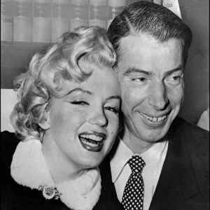 Marilyn Monroe with Joe DiMaggio during their wedding ceremony