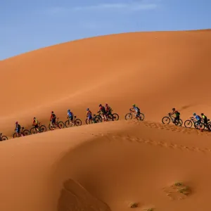 Morocco Cycling Print - Mountain Bikers on Sand Dunes Morocco Cycling Print - Mountain Bikers on Sand Dunes