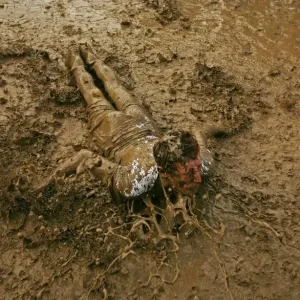 A music fan slides in the mud, at the Glastonbury music festival, Pilton, Somerset 22 June 2007 A music fan slides in the mud, at the Glastonbury music festival, Pilton, Somerset 22 June 2007