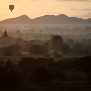 Print of a hot-air balloon over ancient Bagan monuments Print of a hot-air balloon over ancient Bagan monuments