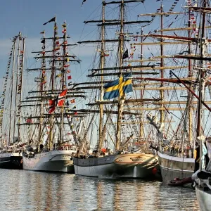 People look at ships docked at the Lithuanian Baltic Sea port of Klaipeda on August 2 People look at ships docked at the Lithuanian Baltic Sea port of Klaipeda on August 2