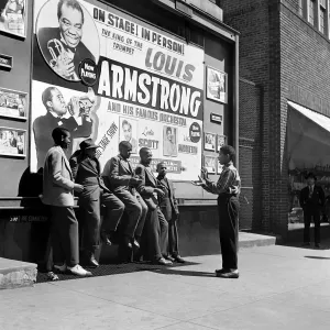 Playing in front of a Louis Armstrong Poster Playing in front of a Louis Armstrong Poster