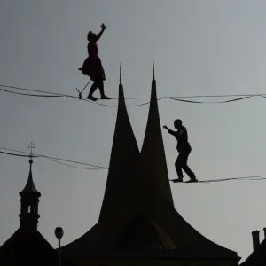 Print of tightrope artists in Prague