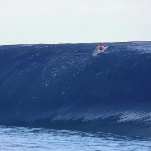 Print of a surfer riding a wave at Teahupoo, Tahiti Print of a surfer riding a wave at Teahupoo, Tahiti