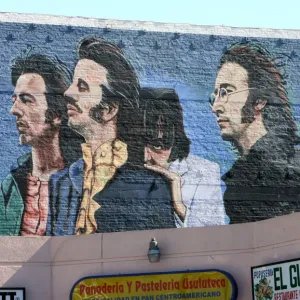 A print of a mural in Los Angeles features four musicians A print of a mural in Los Angeles features four musicians