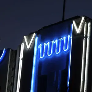 Print of a waxing crescent moon over an Art Deco building on Miami Beach