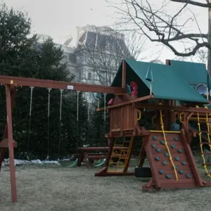 Print of a newly installed swing set on the White House south lawn Print of a newly installed swing set on the White House south lawn