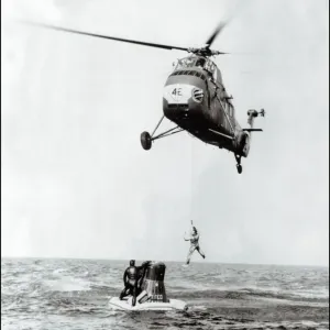 Print of John Glenn being evacuated from Friendship 7 by helicopter