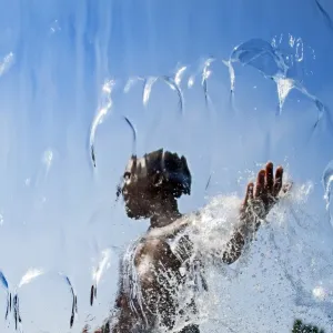 Print of a boy walking through a waterfall in Washington, DC
