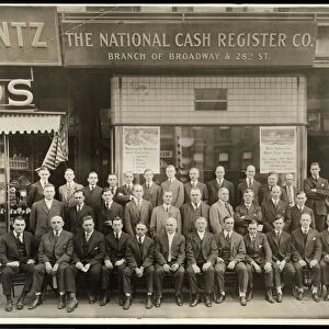 Group of men of the National Cash Register Co. posed in front of the Broadway
