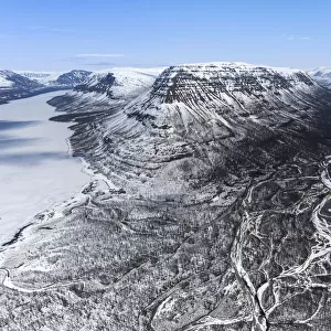 Frozen lake and snow covered plateau, Putoransky State Nature Reserve, Putorana Plateau, Siberia, Russia. May, 2021