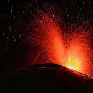 Lava erupting from Reventador volcano at night, El Chaco, Napo, Ecuador. October, 2020
