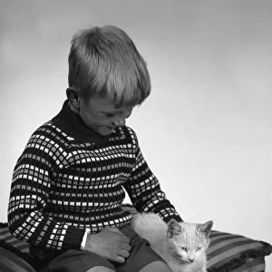 Child with a cat, 1963. Artist: Michael Walters
