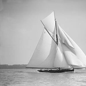 The gaff rigged cutter Bloodhound sailing downwind with spinnaker, 1911. Creator
