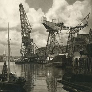 Kiel - Giant floating crane of the Germania Shipbuilding Yards, 1931. Artist: Kurt Hielscher