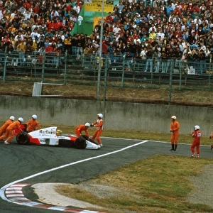 Formula One World Championship: Team-mates Ayton Senna and Alain Prost McLaren MP4 / 5, crash out of the race