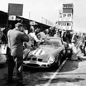 Goodwood, West Sussex, Great Britain. 24 August 1963: Graham Hill, Ferrari 250GTO, 1st position, pitstop, action