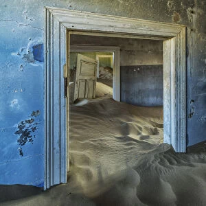 Drifting Sand Fills The Rooms Of A Colourful Abandoned House; Kolmanskop, Namibia