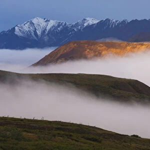 Fog Settles Between Mountain Ridges At Sunrise In Sable Pass, Denali National Park, Alaska