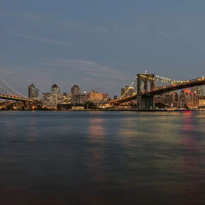 Manhattan And Brooklyn Bridges At Sunset; New York City, New York, United States Of America