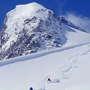 Two Young Men Skiing Untracked Powder In Figure 8 s, Bugaboo Glacier Provincial Park, British Columbia, Canada
