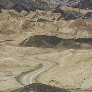 Dirt road winding through rock formations, Twenty Mule Team Canyon, Death Valley National Park