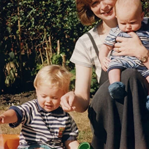 Athlete Jonathan Edwards Alison Edwards playing with her sons