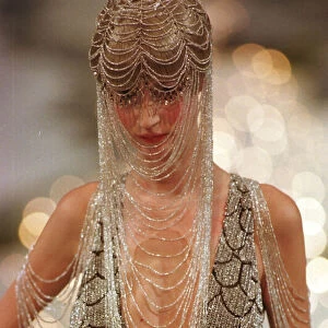 Clothing by Givenchy 1998 model wearing Givenchy designed dress walking on catwalk