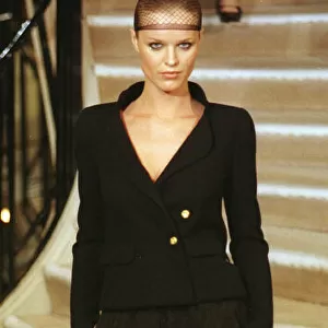 Eva Herzigova wearing Chanel 20 January 1998: wearing hair net and black suit