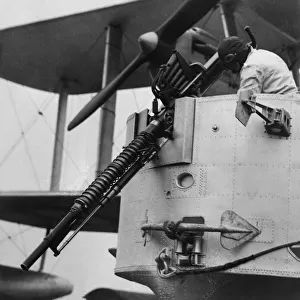 A gunner checks the Coventry Ordnance Works C. O. W 37 mm autocannon in the bow gunners
