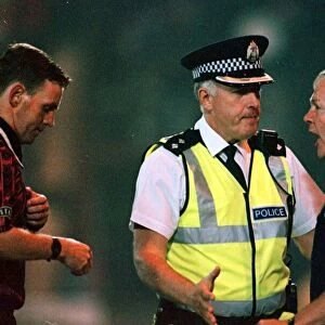 John Blackley St Johnstone assistant manager 20 / 8 / 97 is spoken to by a policeman