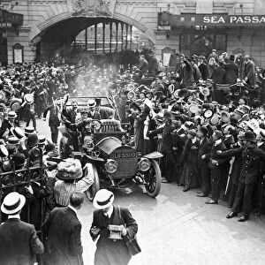 London welcomes Louis Bleriot: Cheering crowds greet the intrepid aviator as he leaves