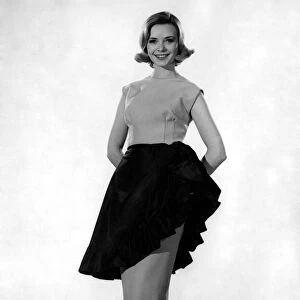 Model Sarah Browne wearing sleveless tio with long skirt. April 1961 P008748