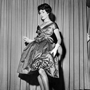 Pat O Reilly modeling a short evening dress called "Amour"